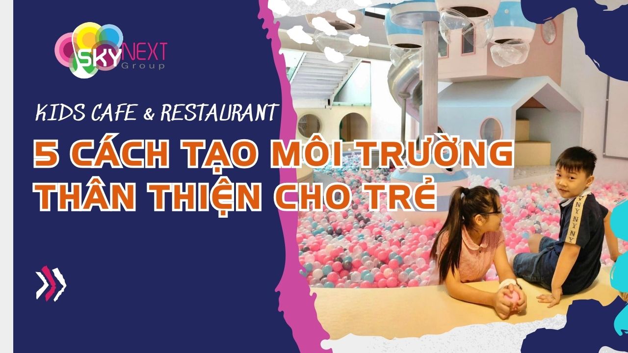 Hai trẻ ngồi cạnh hồ bóng nhiều màu ở khu vui chơi trong nhà