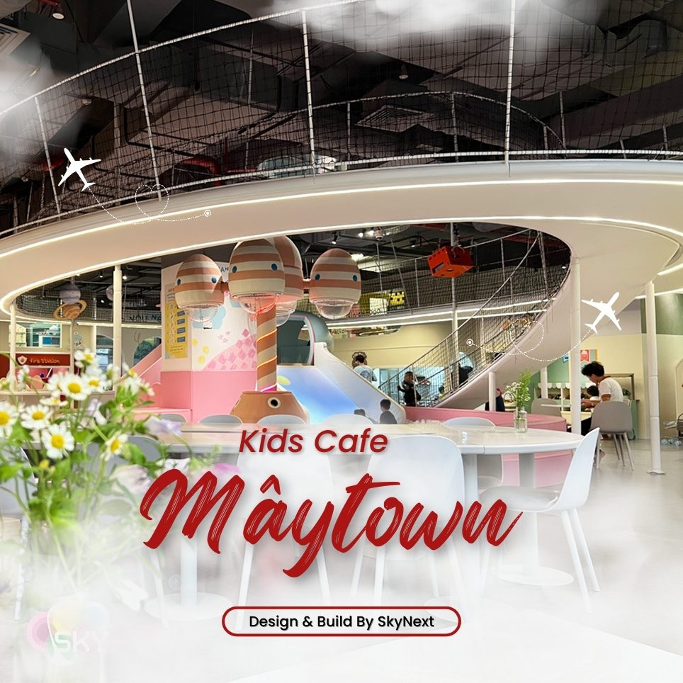 Không gian quán cafe trẻ em với khu vui chơi màu pastel và bàn ghế
